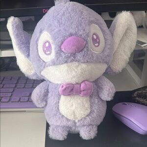 Purple Stitch stuffed animal